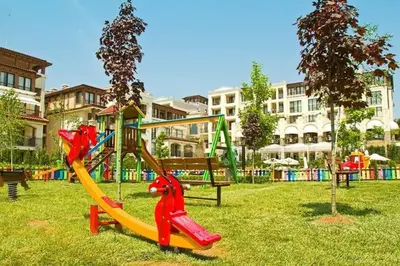 a playground with a slide in a park at Apartment Beach Kavatsi in Sozopol