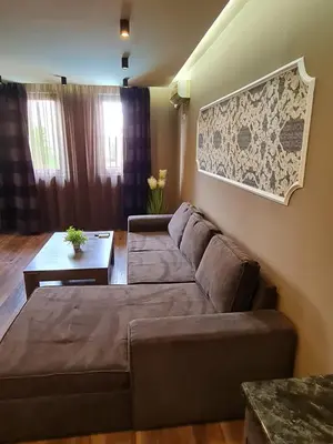 a living room with a couch and a table at MitProt Panorama Bay 2 luks apartment ap.73 in Sveti Vlas