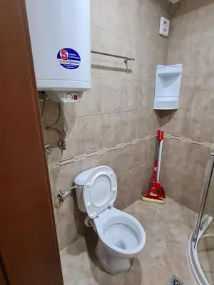 a bathroom with a white toilet in a stall at MitProt Panorama Bay 2 luks apartment ap.73 in Sveti Vlas