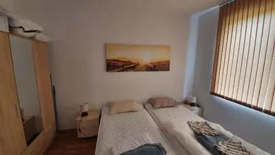 a bedroom with two twin beds in a room at Pomorie Beach Resort in Pomorie