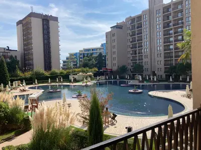 a view of a pool in a city with buildings at Royal Beach Apartament Hotel in Sunny Beach