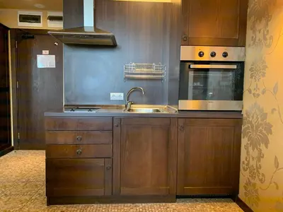 a kitchen with a sink and a stove at Royal Beach Apartament Hotel in Sunny Beach