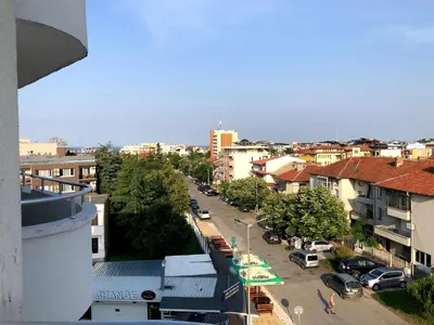 a view of a city street with cars and buildings at студио S in Primorsko