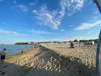 a group of people standing on a beach at ANITA A3 Cosy Studio SUNNY BEACH in Sunny Beach