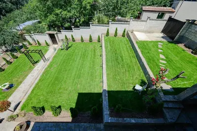 an aerial view of a garden with green grass at Villa Baywatch in Galata