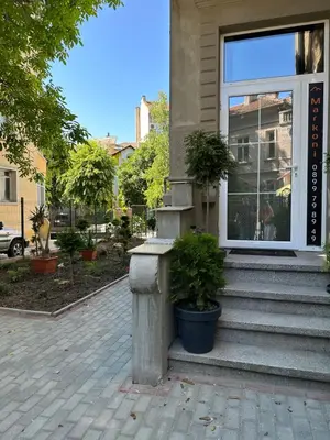 a house with some plants in front of a window at Markoni 1 in Burgas City