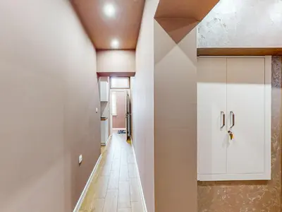 a hallway of a house with a white cabinet at Markoni 1 in Burgas City