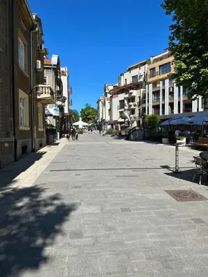 an empty street in a city with buildings at Markoni 2 in Burgas City