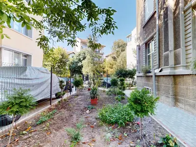 a garden in front of a building with plants at Markoni 2 in Burgas City