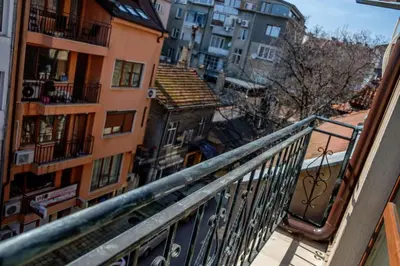 a balcony with a view of a city with buildings at Charisma apt - lux at top city center in Varna City