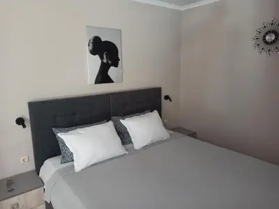 a bedroom with a bed with two white pillows at AMARA-BOUTIQUE & DESIGN - Студио in Ravda