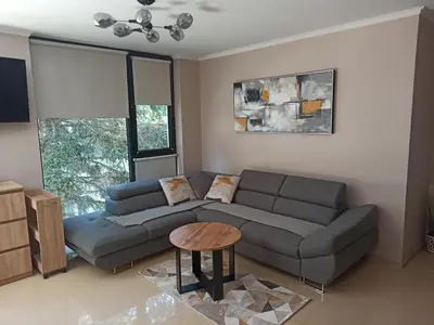 a living room with a couch and a table at AMARA-BOUTIQUE & DESIGN - Студио in Ravda