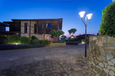 a house with a street light in front of it at Luxury 3-bedroom villa in Sozopolis with sea view in Sozopol