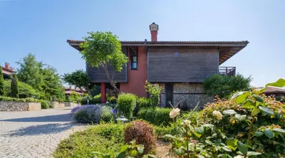 a house with a garden in front of it at Luxury 3-bedroom villa in Sozopolis with sea view in Sozopol