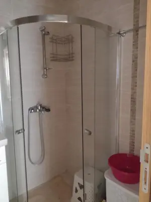 a shower with a glass door in a bathroom at Messembria Resort in Sunny Beach
