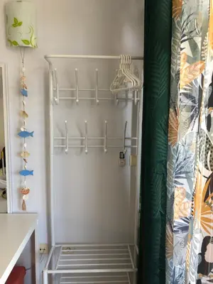 a white refrigerator in a kitchen with shelves at Apartment Black Sea Shark in Chernomorets