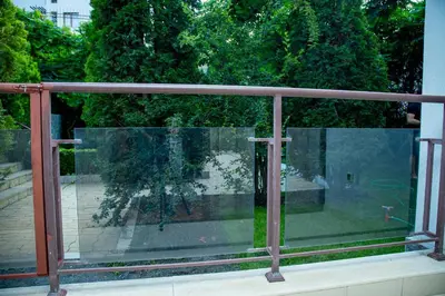 a glass window with a view of a yard at Helios Studio in a Complex in St Vlas by Flat Mаnаger in Sveti Vlas