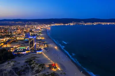 an aerial view of a beach at night at Sunny View Central - Menada Apartments in Sunny Beach
