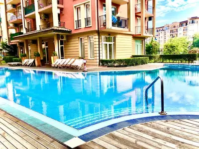 a large swimming pool in front of a building at Sunny View Central - Menada Apartments in Sunny Beach
