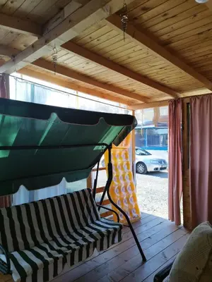 awning over a bench in a screened in porch at каравана Марбея in Chernomorets