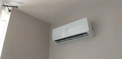 a wall mounted air conditioner in a room at Atlantis Atmosphere Apartment in Burgas City