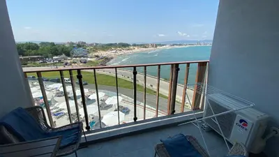 a balcony with chairs and a view of the beach at PARADISO 'В' 408 Private Studio Nessebar in Nesebar