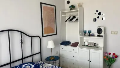 a bedroom with a bed and a dresser at PARADISO 'В' 408 Private Studio Nessebar in Nesebar