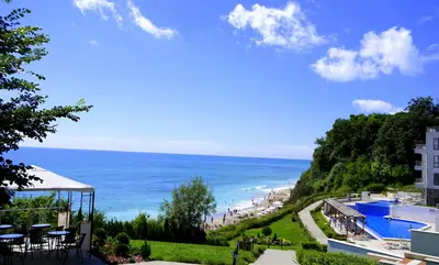 a view of the beach from a resort at Бяла Клиф Форест - Byala Cliff Forest in Byala