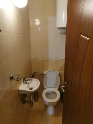 a bathroom with a toilet and a sink at Silver A 27 in Byala