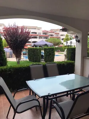 a table and chairs on a patio with a view at Casa Real B 5-1 in Sveti Vlas