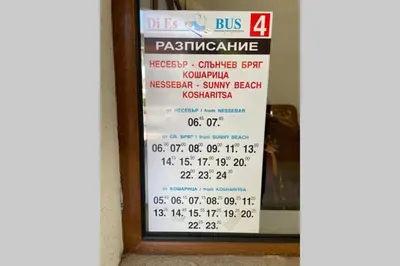 a sign in the window of a bus restaurant at Apartment Doris in Sunny Beach