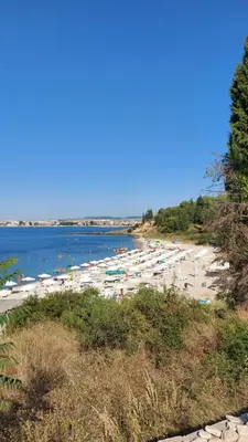 a beach with a bunch of boats in the water at Акротирия Фешева in Nesebar
