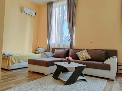 a living room with a couch and a coffee table at Pool Apartment Amadeus Lux in Sunny Beach