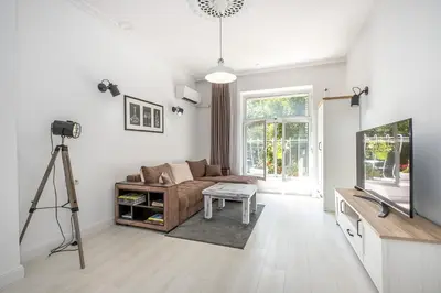a living room with a couch and a camera at Jazz & Wine - Luxury apARTment By The Sea & Parking & HBO & Netflix in Varna City
