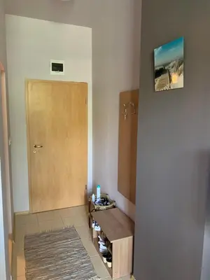 a room with a wooden door and a wooden table at AFRODITA I 112 Private Cozy Studio Sunny Beach in Sunny Beach