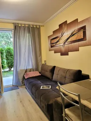 a living room with a couch and a table at Studio VIP-ZONE in Sunny Beach