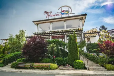 a building with a bench in front of it at Sunrise - Apartment 41,Santa Marina, Sozopol in Sozopol