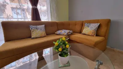 a living room with a couch and a glass table at Apartment Casa del Mar (Dinevi Resort) in Sveti Vlas