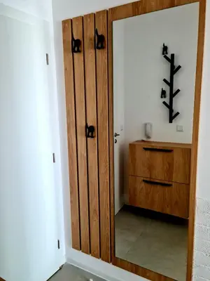 a bathroom with a wooden door and a mirror at Studio Greenn Life Beach Resort in Sozopol