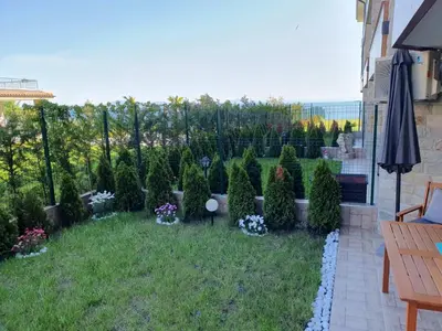 a garden with trees and plants in a yard at Sarafovo Sea Star in Burgas City