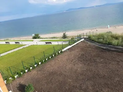 a garden with the beach in the background at A-19 Sea View Studio-Apartmen Sarafovo in Burgas City