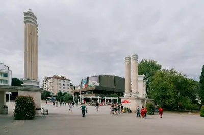 a group of people walking in front of a building at Апартамент BOHO CHIC Free parking in Varna City