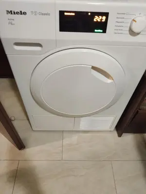 a washing machine is sitting on a tile floor at Apartment Lazur Karlovo 8 street free parking in Burgas City