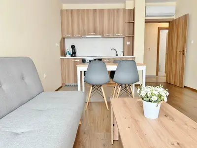 a living room with a couch and a table at Central Flat & Free Parking in Varna City