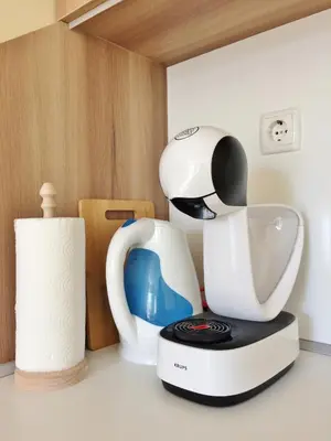 a white blender sitting on top of a counter at Central Flat & Free Parking in Varna City