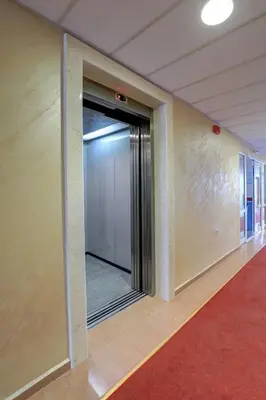 an open door in a hallway with a red carpet at Paraiso Beach - All Inclusive in Obzor