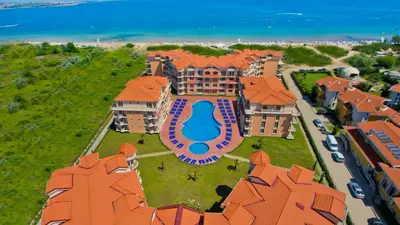 an aerial view of a mansion with a swimming pool at Touristic Complex Hacienda Beach Apartments Sozopol in Sozopol