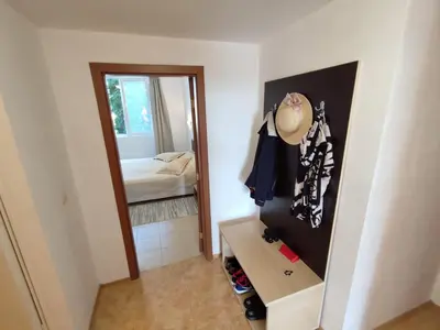 a small room with a mirror and a bed at Midia Grand Resort, Terrassen Paradies Apartment in Aheloy