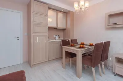 a kitchen and dining room with a table and chairs at Monte Carlo in Sunny Beach