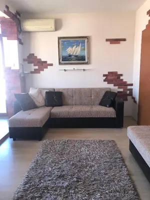 a living room with a couch and a rug at Dunav Apt.4 in Ravda
